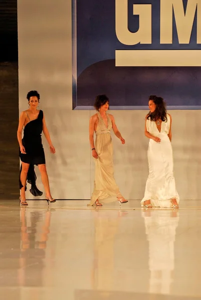 Alexandra Hedison with Katherine Moennig and Erin Daniels on the runway at General Motors Annual Ten Event. Vine Blvd, Hollywood, CA. 02-28-06