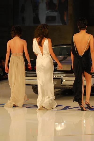 Katherine Moennig with Erin Daniels and Alexandra Hedison on the runway at General Motors Annual Ten Event. Vine Blvd, Hollywood, CA. 02-28-06