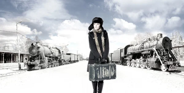 Retro photo of young and attractive woman on the train station