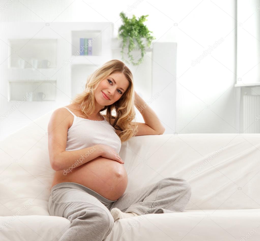 http://st.depositphotos.com/1814366/1543/i/950/depositphotos_15435469-Young-attractive-pregnant-woman-on-the-sofa-isolated-on-white.jpg