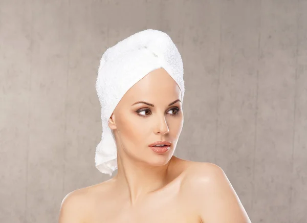 Spa portrait of young attractive woman in towel