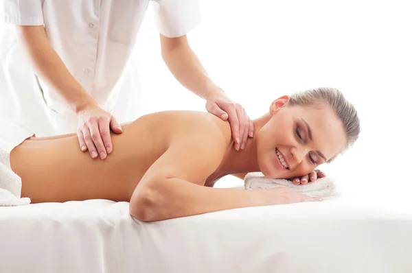 Young attractive woman getting spa treatment over white background