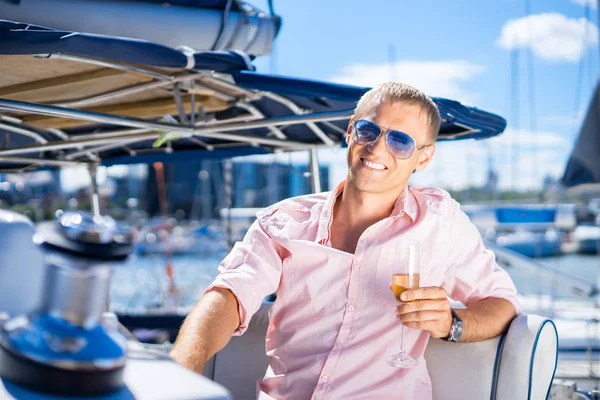 Handsome man on luxury yacht
