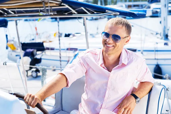 Handsome man on luxury yacht