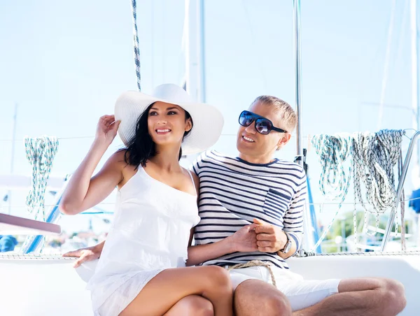 Attractive couple on sailing boat