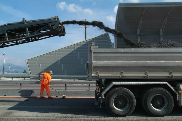 Asphalt mixture Trucks building a highway