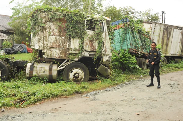 Abandoned truck wreck and train wagon