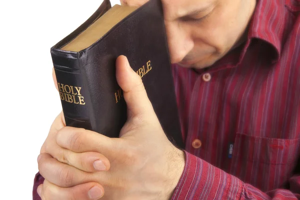 Man Praying Holding the Bible