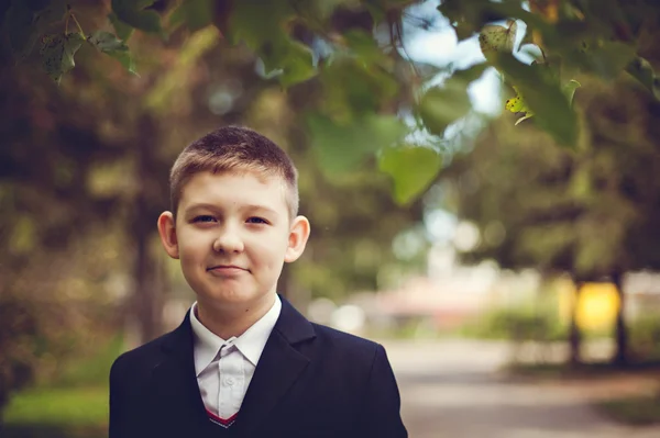 Young male teenager smiling in the afternoon in the park.