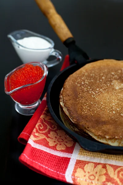 Pancakes with red caviar