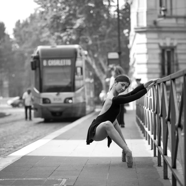 Young beautiful ballerina dancing out in the street in Rome, Italy. Black and white image. Ballerina Project.