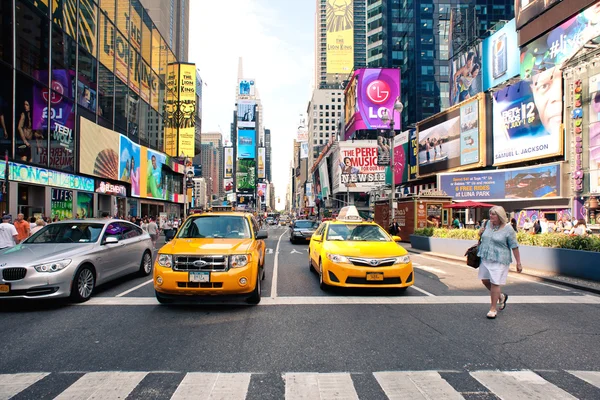 Times Square is a busy tourist intersection of commerce Advertisements and a famous street of New York City and US