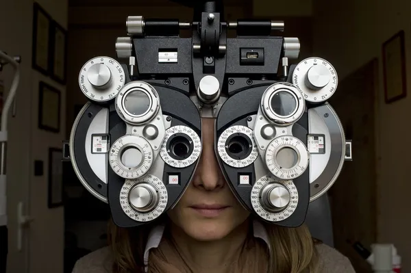Optometrist diopter with girl