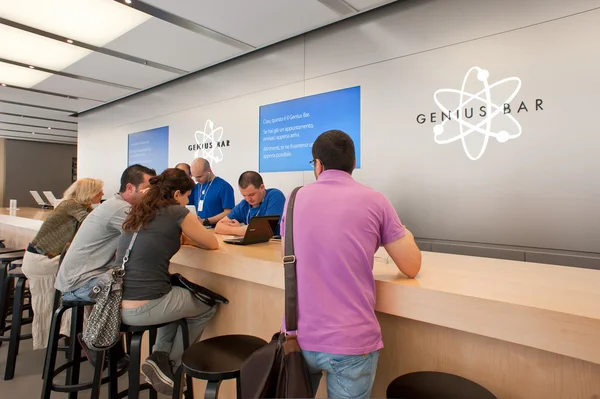 BOLOGNA, ITALY - AUGUST 6: visiting the Apple Store on August 6, 2012 in Bologna, Italy. Apple has 363 stores worldwide, with global sales of 16 billion US dollars in merchandise in 2011