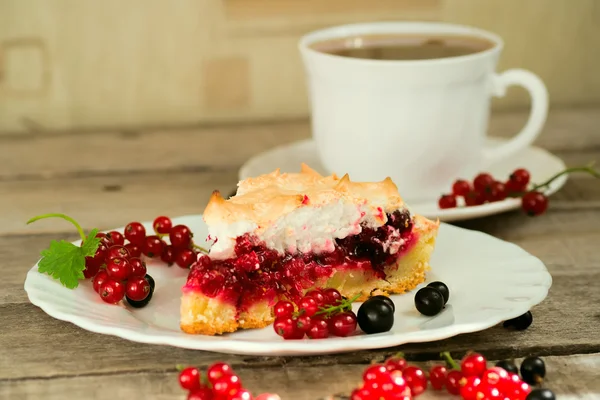 Piece of berry pie and cap of tea