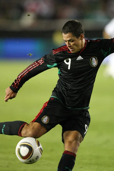 Javier Hernandez crosses the ball during the match