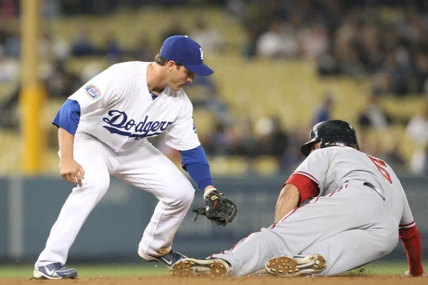 Ryan Theriot puts a late tag on Ian Desmond during the game