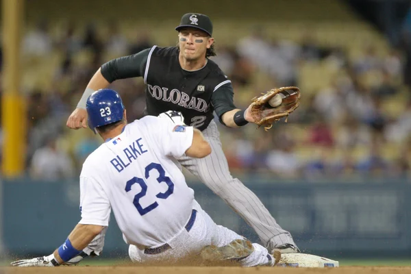 TROY TULOWITZKI tags out CASEY BLAKE as he slides into second during the game