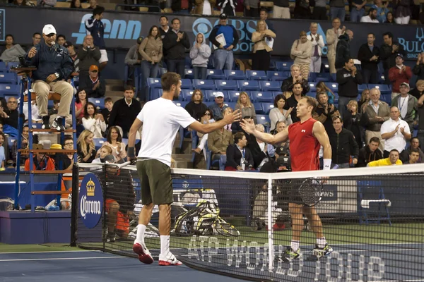 Michael Russell and Benoit Paire shake hands at the end of the match