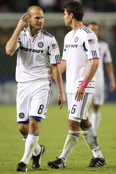 Freddie Ljungberg and Peter Lowry during the game