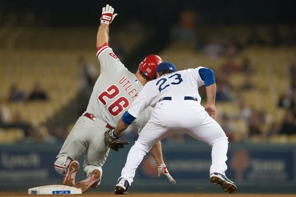 Chase Utley gets tagged out by Casey Blake during the game