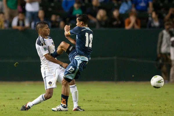 Sean Franklin gets a boot to the chest from Ivan Guerrero during the game