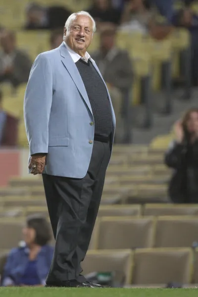 TOMMY LASORDA stands out on the field while fans sing him happy birthday