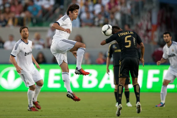Kaka and Sean Franklin in action during the World Football Challenge game