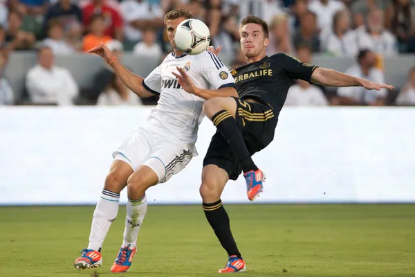 Bryan Gaul and Nacho Fernandez in action during the World Football Challenge game