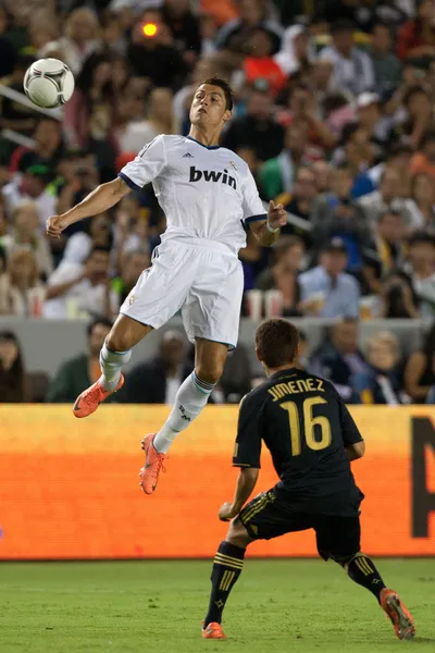 Cristiano Ronaldo heads the ball during the World Football Challenge game