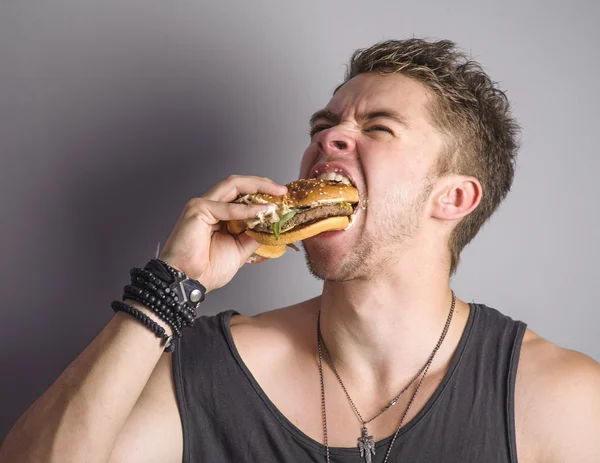 Man eating Hamburger