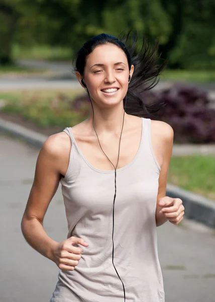 Young woman running in park