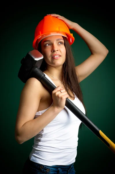 Young woman with a sledgehammer