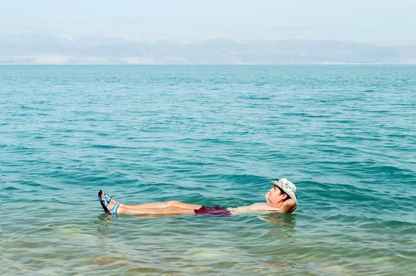 Floating in water of dead sea