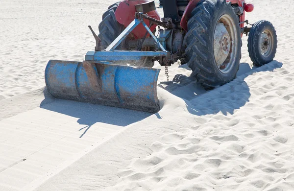 Grader clearing a construction site