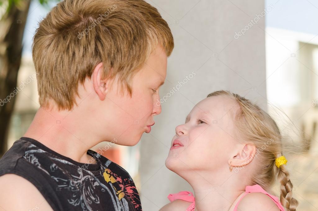 First love: two kissing kids — Stock Photo © servickuz ...