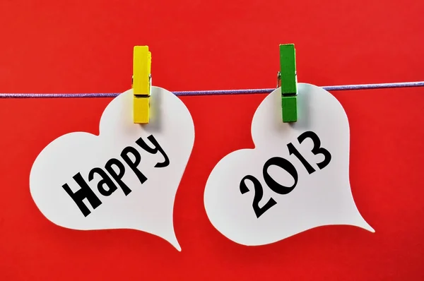 Happy New Year 2013 Message on Pegs Hanging Hearts
