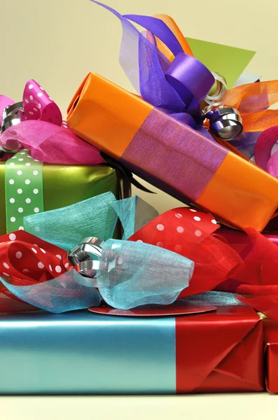 Stack of Bright Color Present Festive Holiday Gifts (vertical)