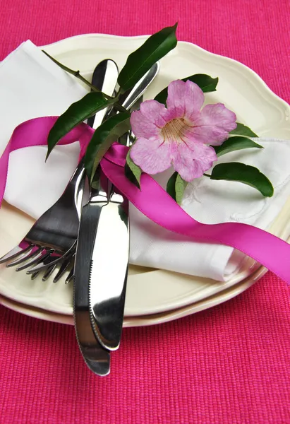 Pink theme dining table setting with silver cutlery (vertical)