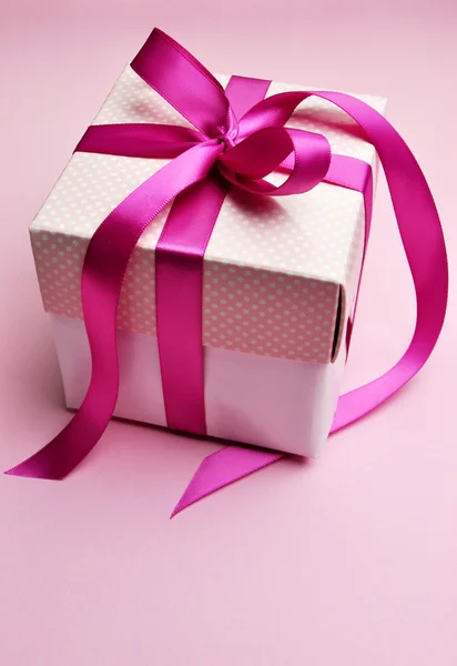 Beautiful pink present gift box with ribbon bows