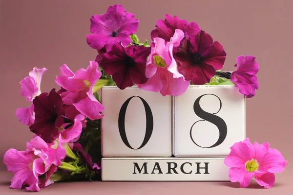 White block calendar for International Women\'s Day, March 8, decorated with pink and purple flowers (horizontal)