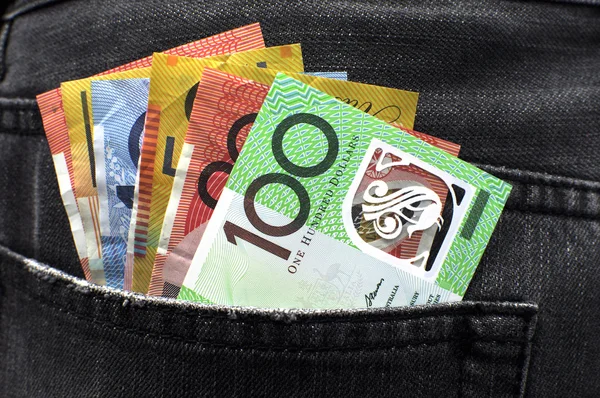 Australian money cash in back pocket of man's jeans