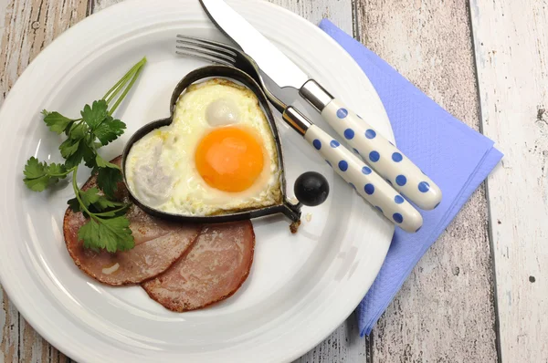 High protein ham and eggs breakfast meal on shabby chic table