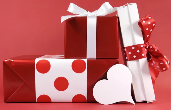 Stack of red and white polka dot theme festive gifts