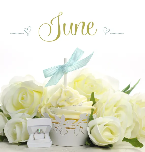 Beautiful cupcake with seasonal flowers and decorations for each month of the year sample text