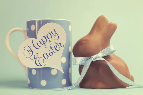 Retro vintage old fashion style Happy Easter chocolate bunny with coffee mug