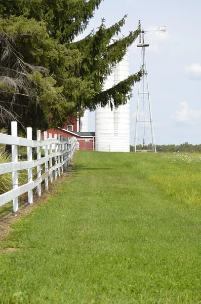 Country fence dividing pastures on a rural Michigan farm