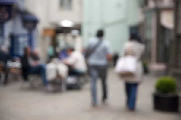 Out of focus shoppers in outdoor mall