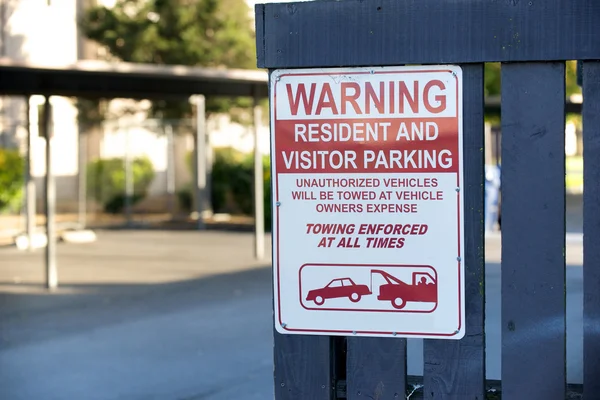 Warning apartment resident parking only sign