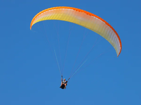 Tandem parachute in blue sky